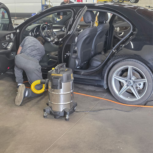 A Keck Parking technician detailing a car